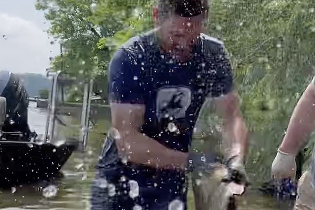 Carrie Underwood's Husband Mike Fisher Tries His Hand — Literally — at Catfish Noodling